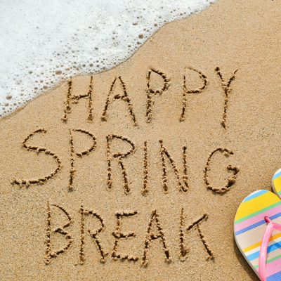 Happy Spring Break, written in sand